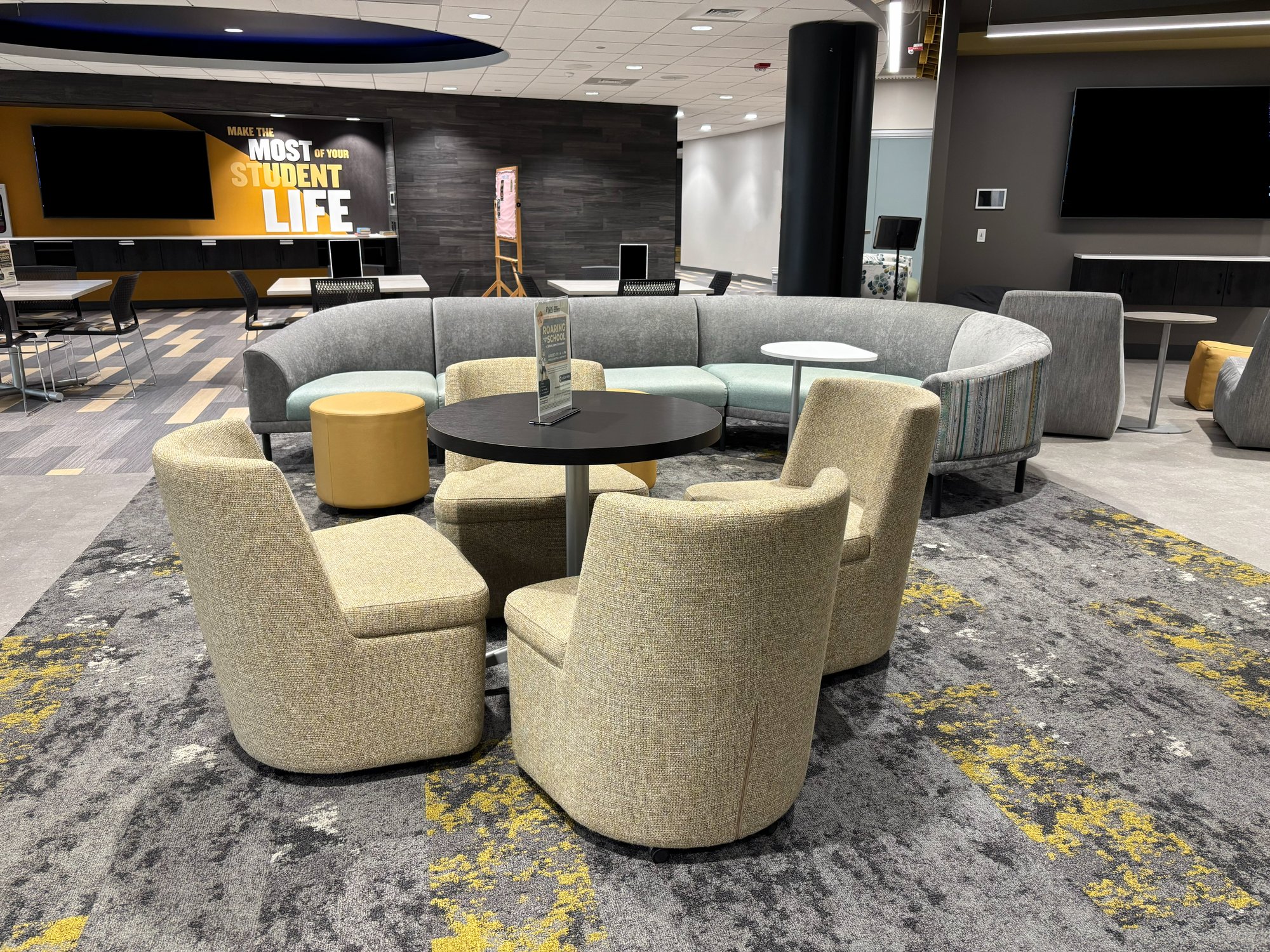 Soft seating in black, gold, and silver colors Soft seating in black, gold, and silver colors