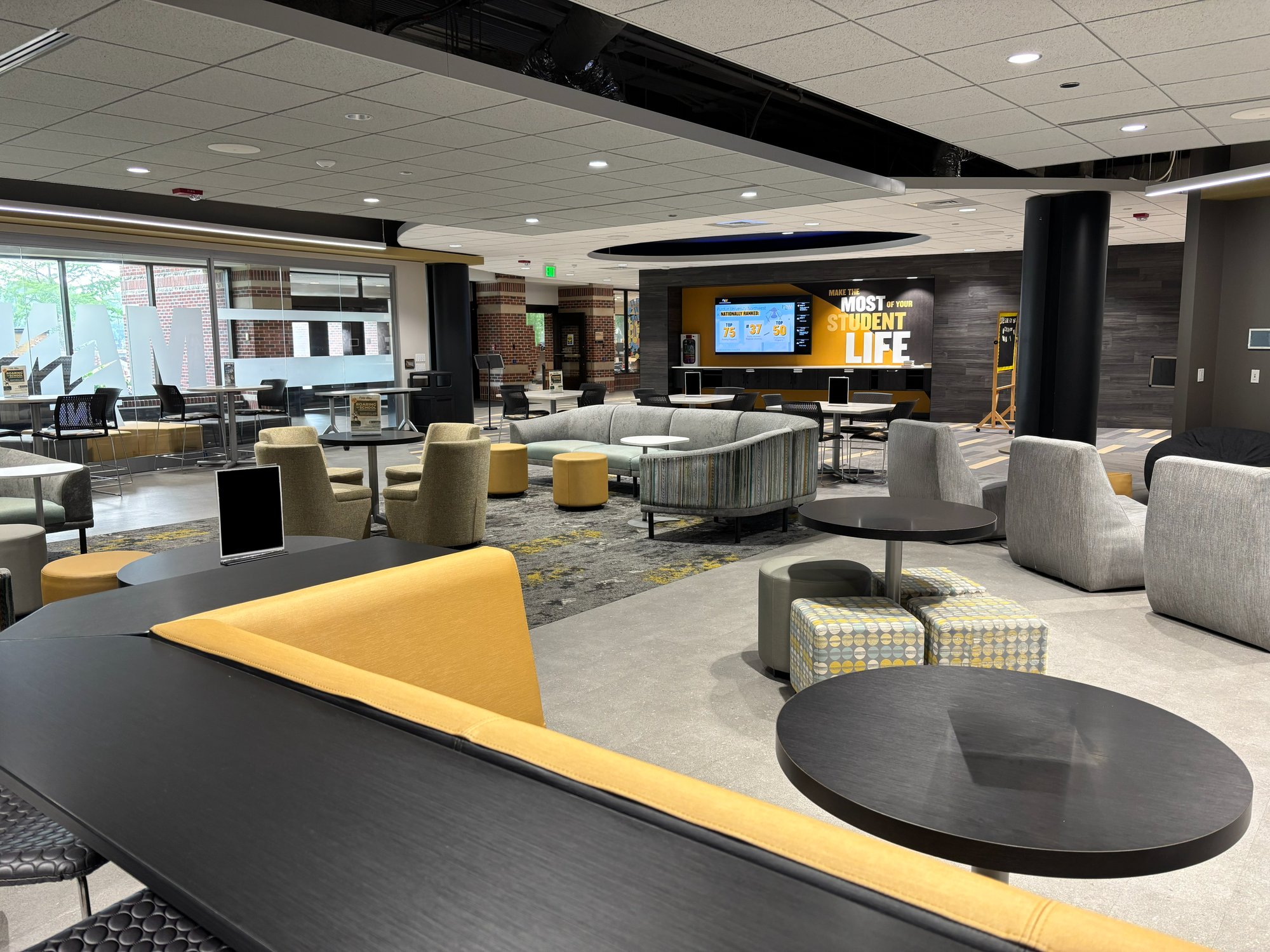 Lounge area with various types of soft seating in silver, black, and gold colors Lounge area with various types of soft seating in silver, black, and gold colors