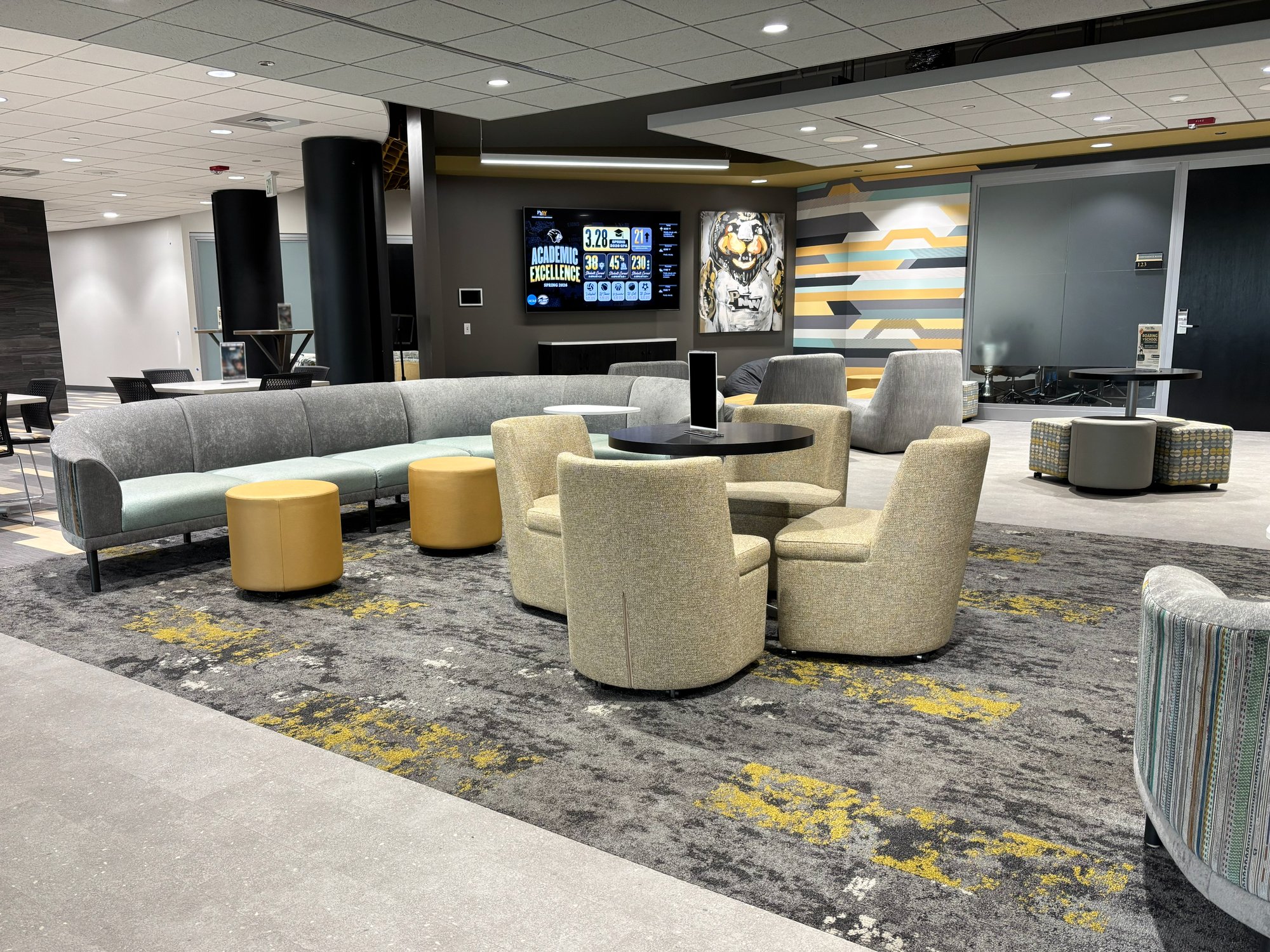 Lounge area with various types of soft seating in black, silver, and gold colors Lounge area with various types of soft seating in black, silver, and gold colors