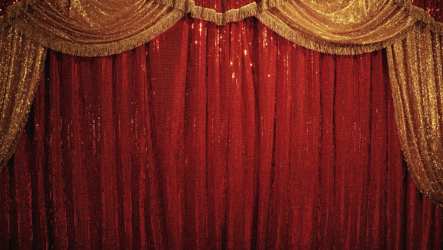 An image of a circus stage with the curtains closed