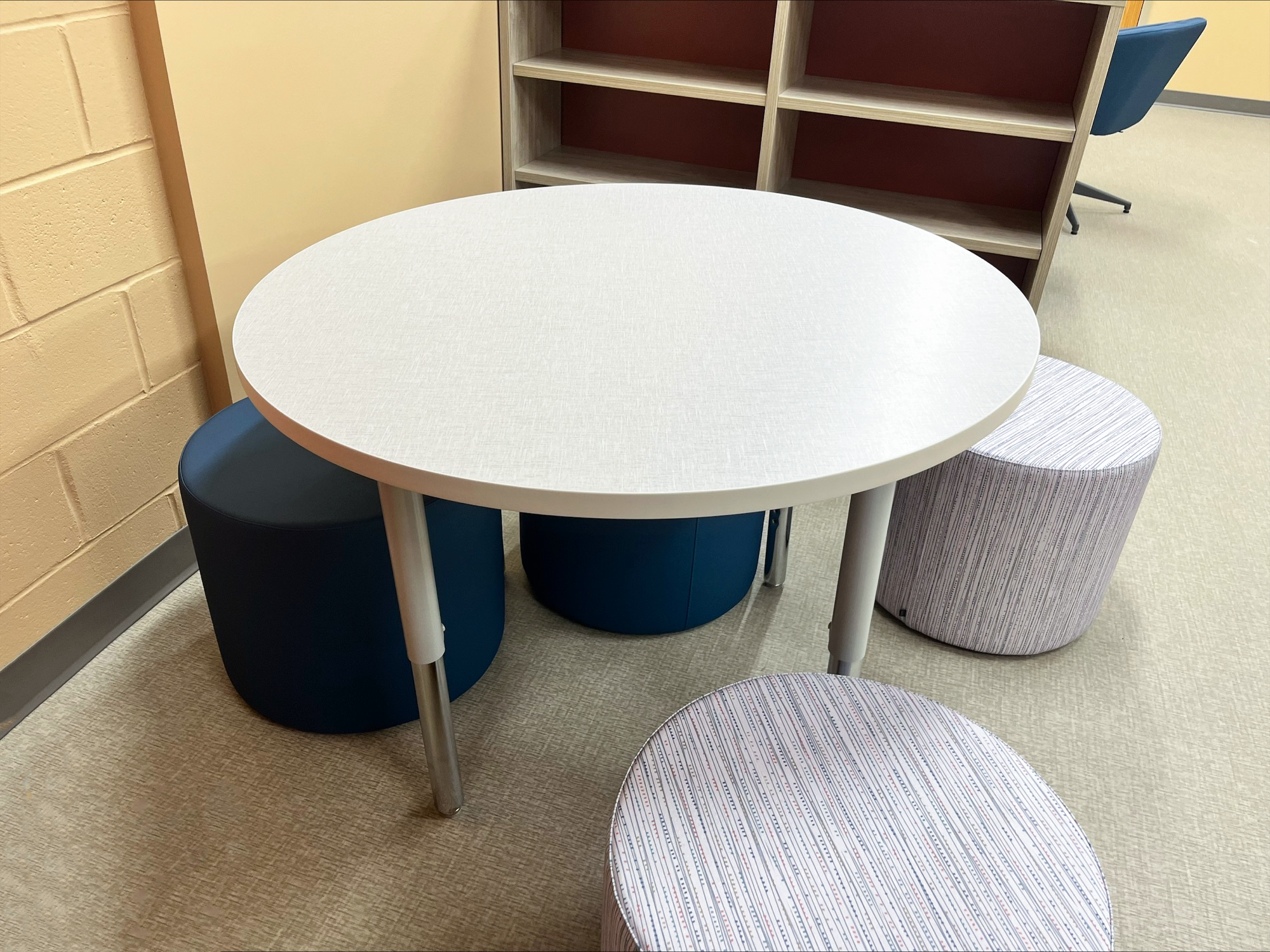 Table with multi-colored stool seats Table with multi-colored stool seats