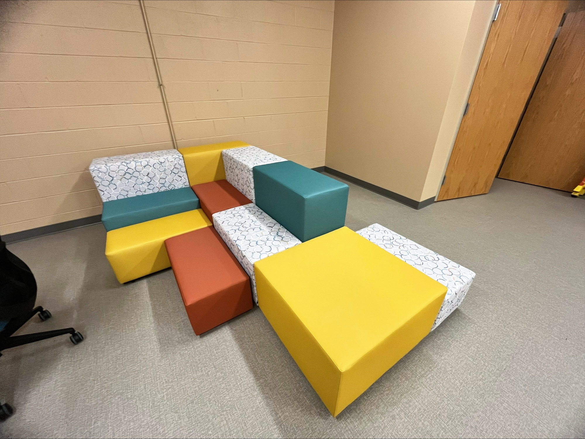 Yellow, teal, orange, and patterned Hon Tangram bench seating Yellow, teal, orange, and patterned Hon Tangram bench seating
