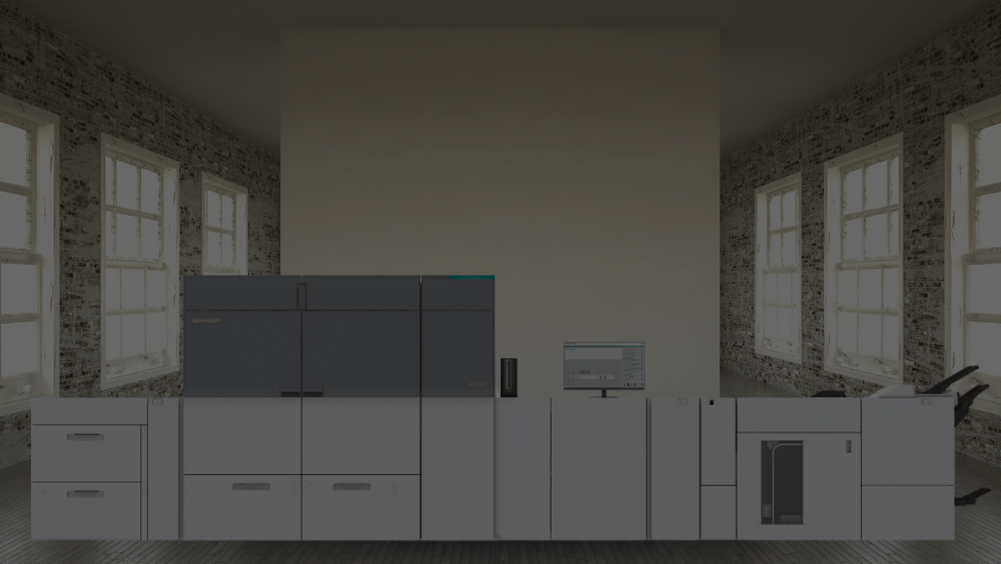 The Sharp BP-1200C / BP-1200S Production Press Printer in an office lined with windows.