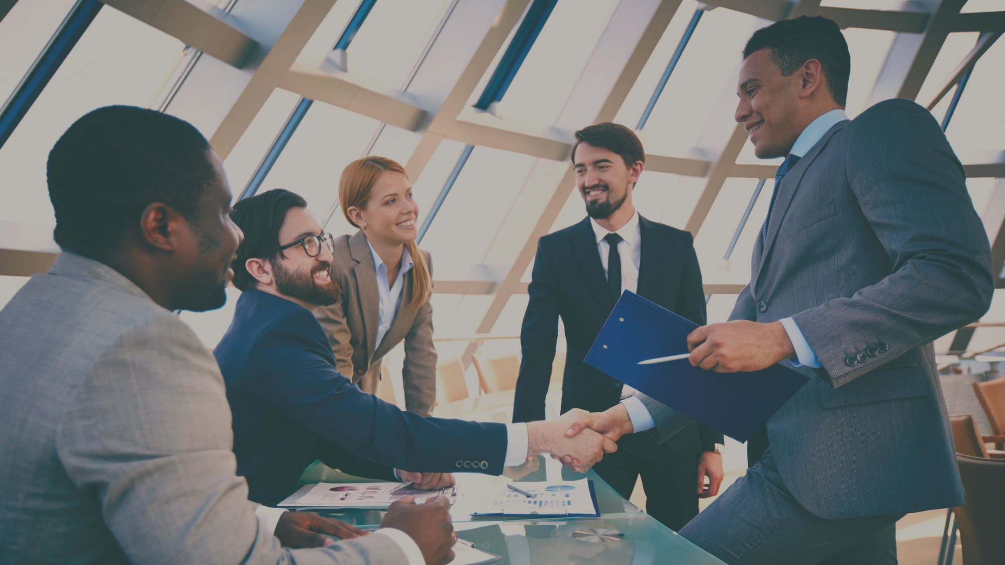 Business employees shaking hands