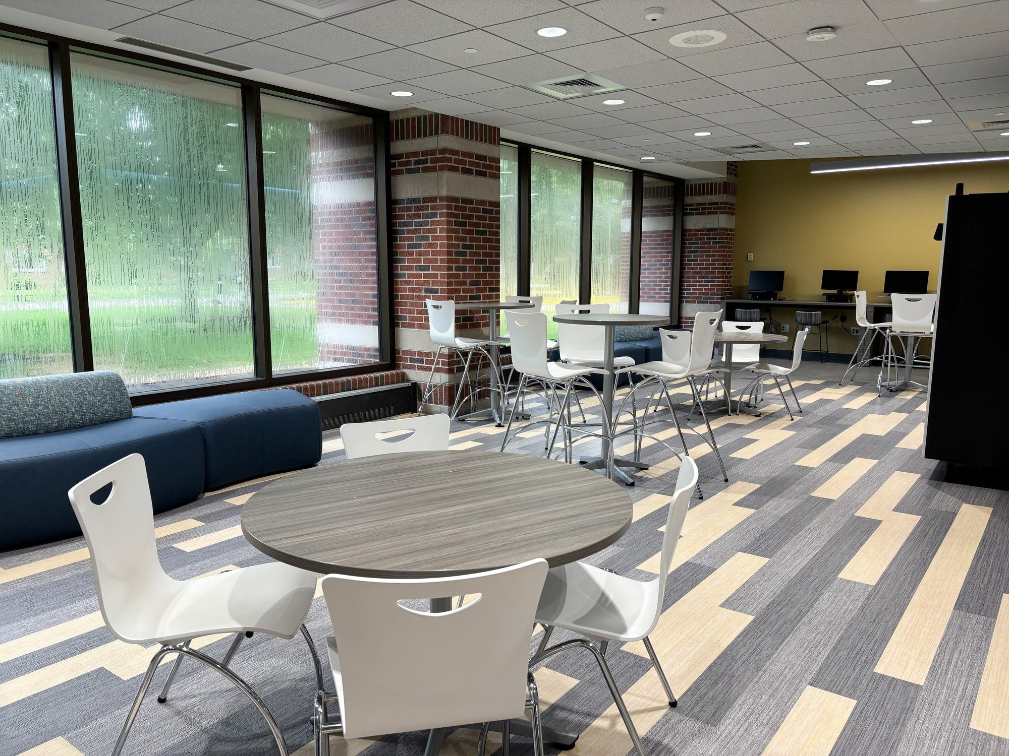Cafe-type seating area with counter-height and regular-height chairs and tables Cafe-type seating area with counter-height and regular-height chairs and tables