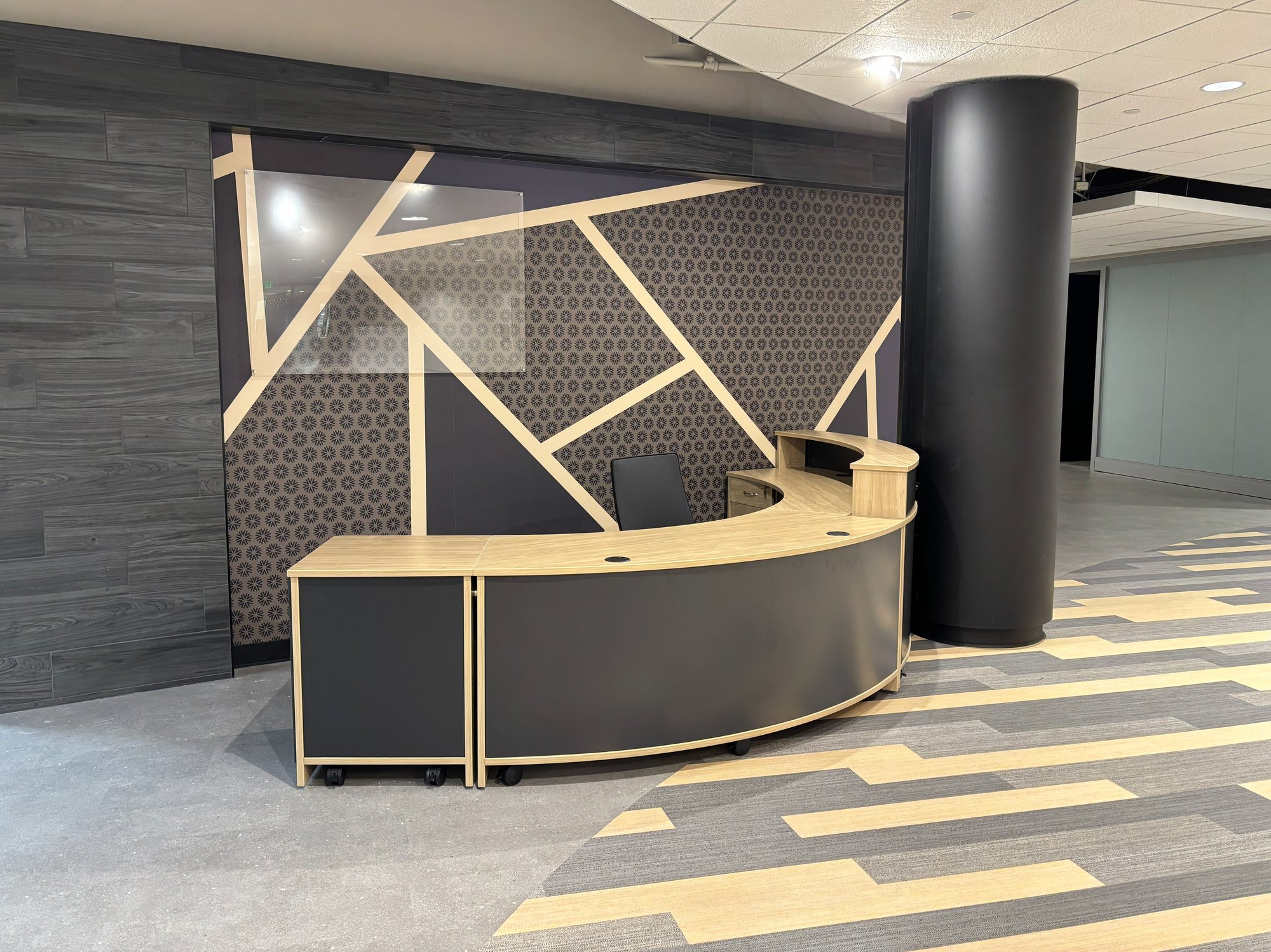 Black, wood, and gold welcome desk Black, wood, and gold welcome desk