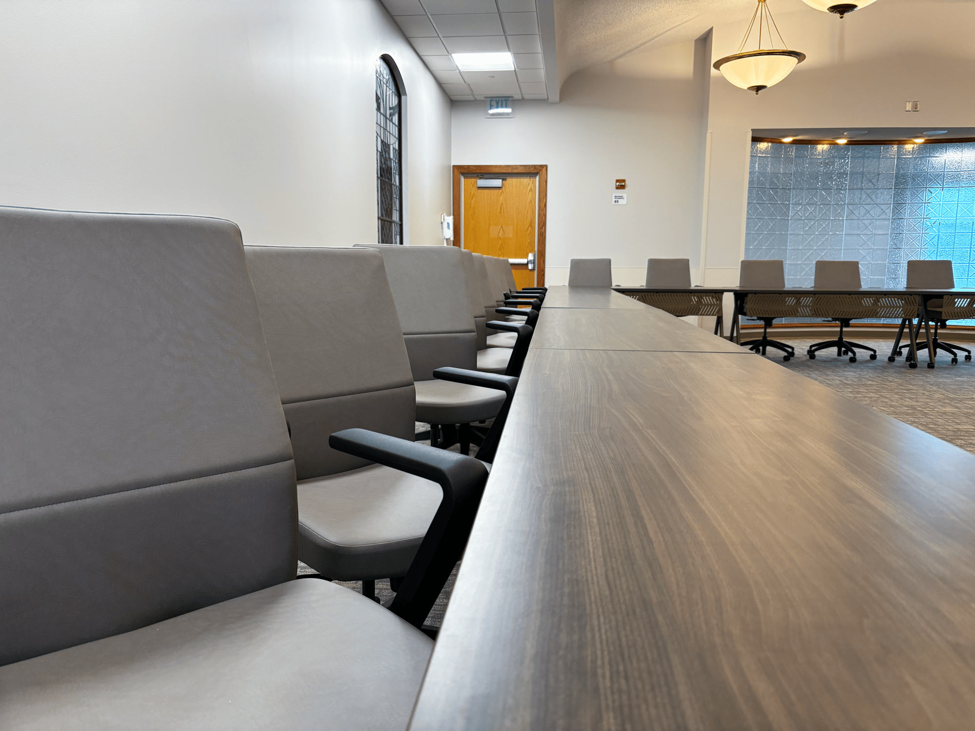 Chairs surround large, mobile tables 