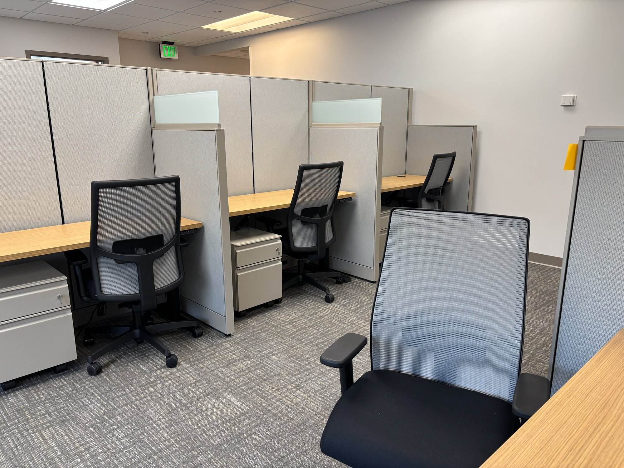 Cubicles with chairs and storage Cubicles with chairs and storage