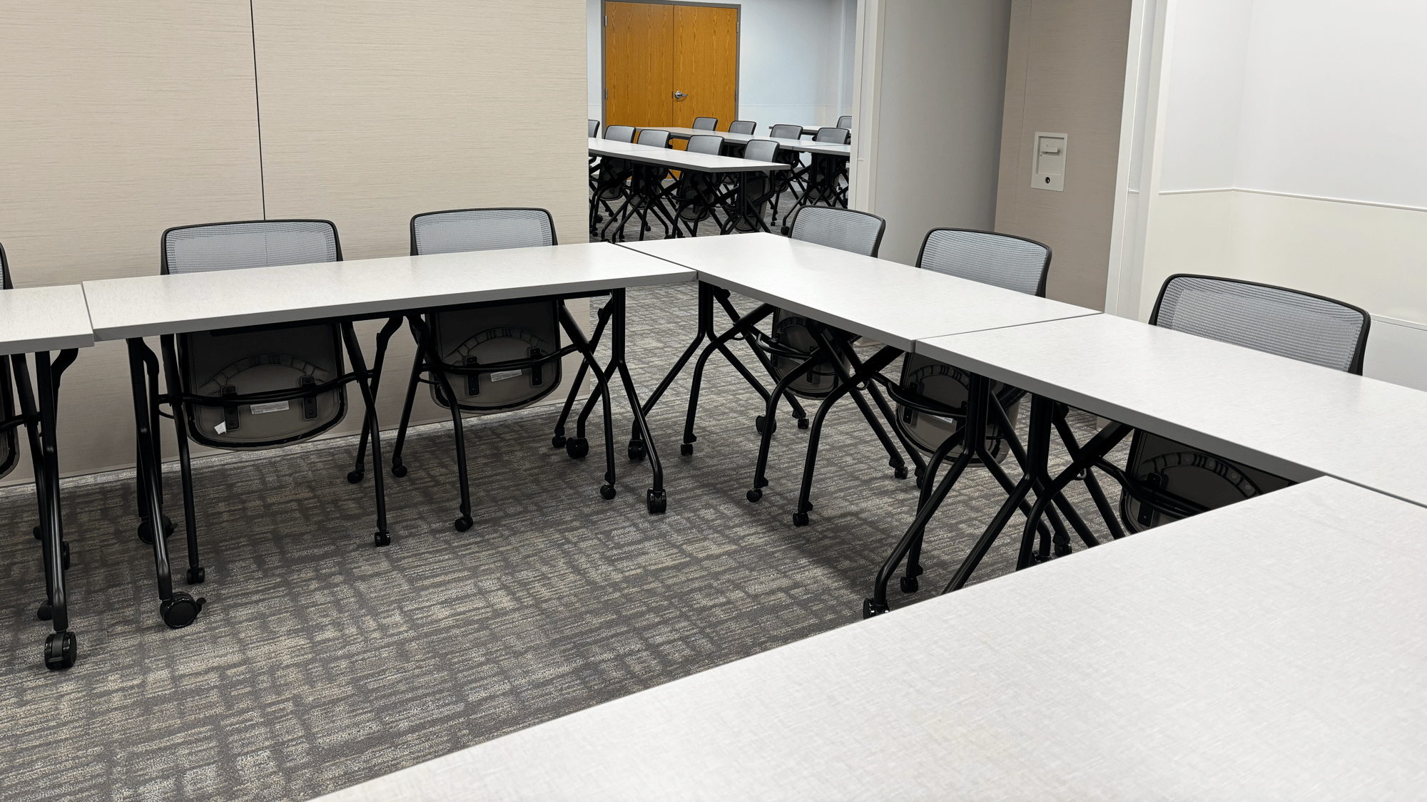 Rolling tables and chairs arranged in a square Rolling tables and chairs arranged in a square