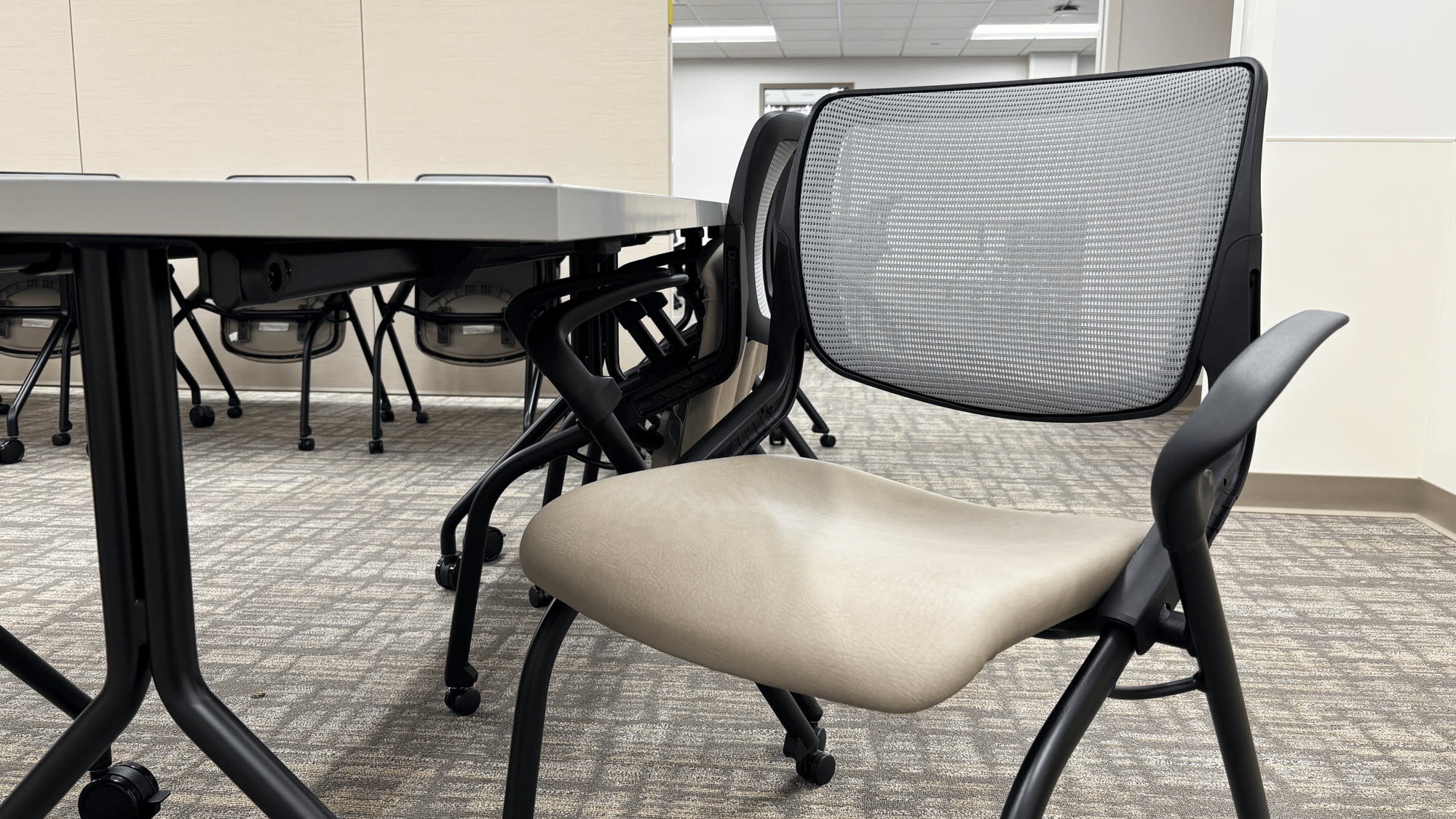 Close-up of a mesh-backed, rolling chair Close-up of a mesh-backed, rolling chair