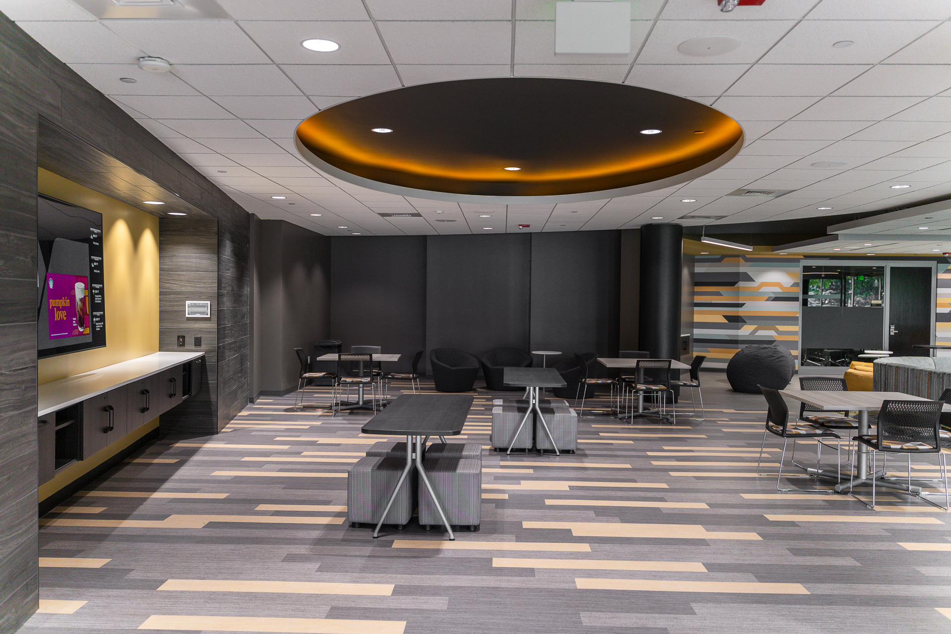 Tables and chairs surrounded by large, gray walls